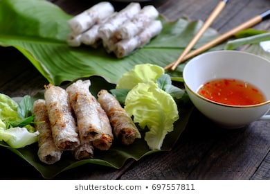 Vietnamese egg roll or spring roll or cha gio is popular food at Vietnam cuisine, stuffing from meat and wrapper by rice paper, then deep fried, eat with salad and fish sauce