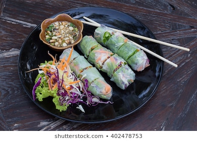 Fresh Vietnamese spring rolls on a plate with salad