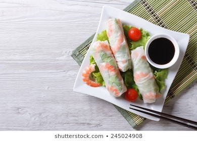 spring roll with shrimp and vegetables on a plate. horizontal view from above 
