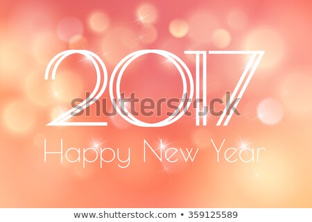 Happy New Year 2017 Card with blue fireworks glowing fire on a peach background blurred. Poster, greeting card, banner or invitation. Vector illustration EPS 10