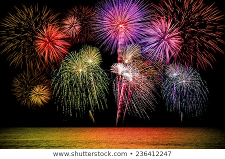 Firework celebration from the sea shore.