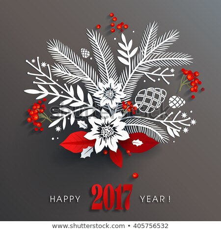 Beautiful white paper floral holiday arrangement and red berries and leaves with long shadows on dark gray background create three-dimensional elegant design for 2017 new year.